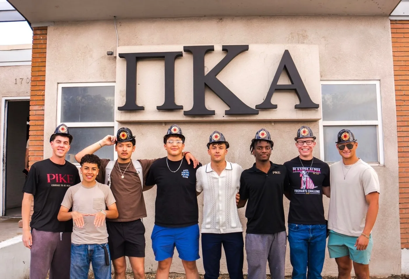 PIKE BROTHERS STANDING OUTSIDE THE PIKE HOUSE.
